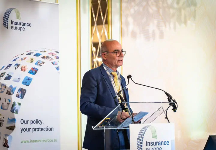 A speaker addressing the conference from the lectern