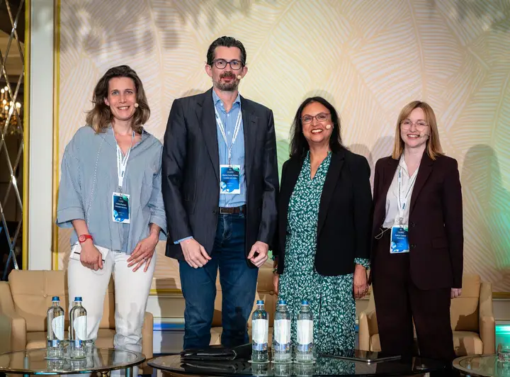 Four panellists on stage after their session
